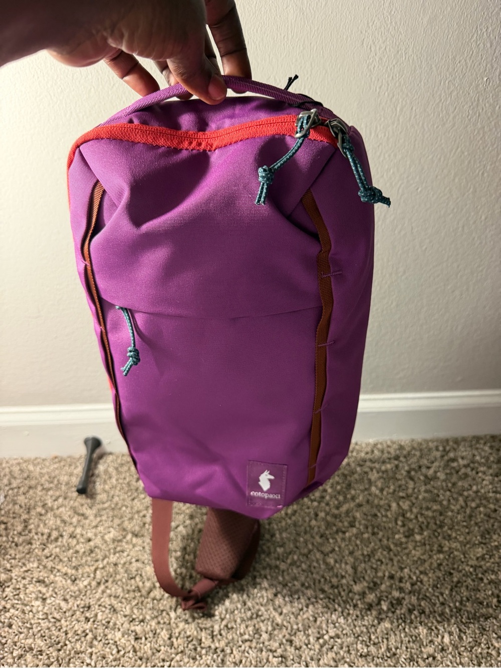 Topo Designs Purple Sling Backpack with Orange Trim and Teal Zippers